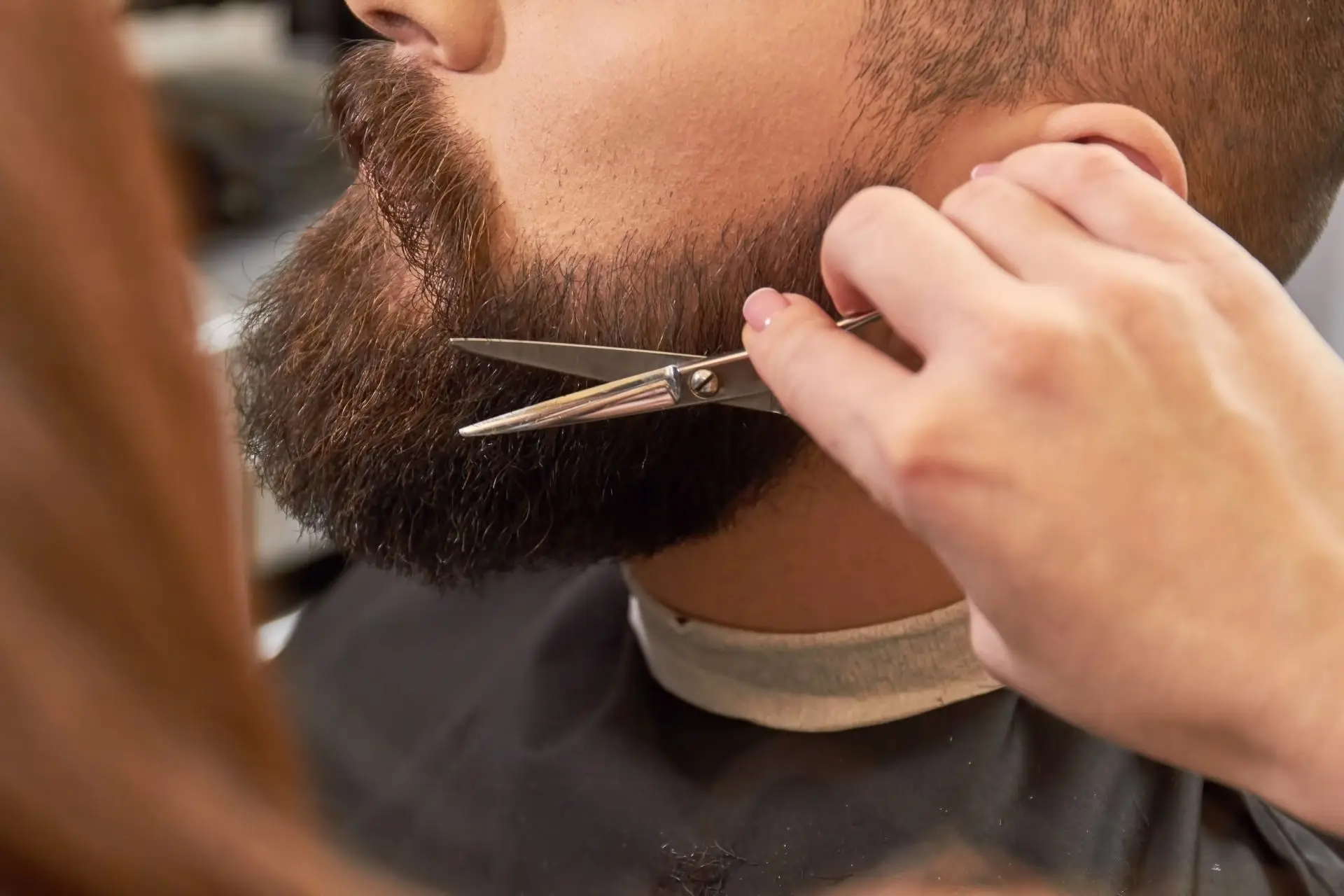 Barber scissors being used on a beard Sharper Focus Ltd mobile sharpening Bristol